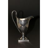 Silver 'helmet' cream jug with bead edge & reeded loop handle, engraved with swags, on square foot,