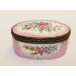 18th century English enamel oval patch or snuff box, floral reserves against pink ground, 6cm wide.