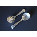 Pair of silver caddy spoons of hourglass pattern with scallop bowls, by Eley & Fearn, 1823.