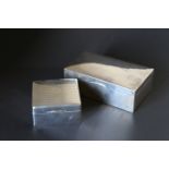 Two silver plain cigarette boxes,