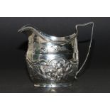 Silver cream jug of ovoid shape, later embossed,1806,