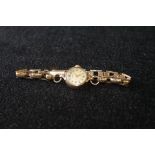 Lady's Record 9ct gold bracelet watch.