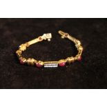 Bracelet with oval cabochon rubies and diamonds in gold, '14k'.