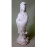 Chinese Republic small blanc de chine figure of Guanyin standing with folded arms, 17cm high.