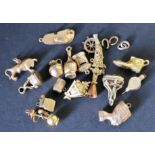 Fourteen various charms, mainly 9ct gold and various others.