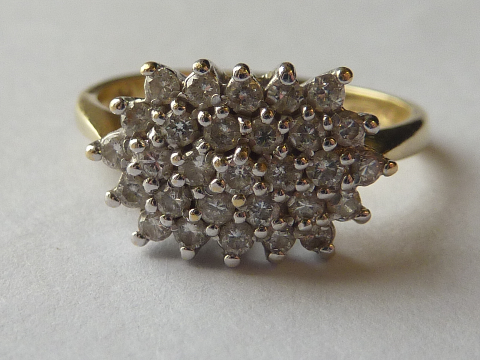 Diamond multi-gem cluster ring with small brilliants, in 18ct gold.
