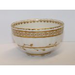 Derby tea bowl of lobed circular form, gilt band & trailing leaf design, factory mark in puce, c.