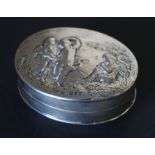 Edwardian silver oval box, the embossed cover with infant dancers by Barnards, 1895,