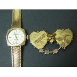 Lady's Roamer 9ct gold bracelet watch and a similar Mizpah brooch "9ct". (2).