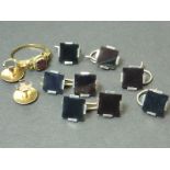 Set of onyx and gold studs, buttons and links, and a garnet ring.