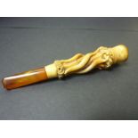 Carved meerschaum cheroot holder of twisted stemwork with amber mouthpiece, C1860.