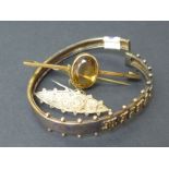 Victorian beaded gold spring bangle, another with Cairngorm and a small 9ct gold brooch (3).