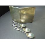 Silver cigarette case and three decorative spoons.