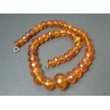 Amber necklace of graduated faceted beads.