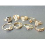 Nine 9ct rings, some gem set. Condition Report.