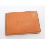 Small autograph album containing signatures some with messages belonging to,