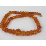 Amber necklace of graduated faceted beads.