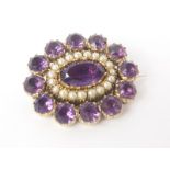 Early 19th century gold oval brooch with amethysts and pearls.