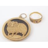 Gold mounted pendant depicting the ram and a gold with gemstone ring.