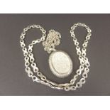 Silver large locket and necklace and another necklace.