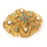 Victorian gold oval brooch with tiny ruby, emeralds and pearls upon matted ground.