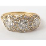 Edwardian diamond ring with three old cut brilliants, approx .3ct and .