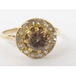 Edwardian diamond cluster ring with old cut cinnamon brilliant, approximately .