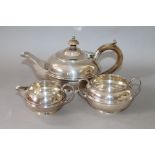 Silver three-piece tea set of early 19th century, compressed spherical shape, 1909.