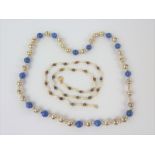 9ct gold pearl and tigers eye necklace and a silver and lapis necklace.