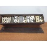 Antique set of bone and ebony backed dominoes.