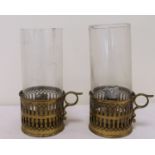 Pair of brass chamber sticks with pierced galleried sides and glass chimneys, each 8½" high.