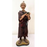 Painted pottery figure of Catweazle, holding his toad "Touchwood", unsigned, 12".