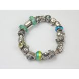 Pandora bracelet with silver and blue,