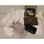 Small collection of various ladies white kid and other gloves, also two small evening purses,