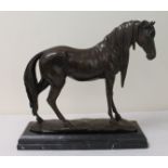 Reproduction bronze figure of a stallion standing on naturalistic base,