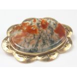 Moss agate oval brooch with 9ct gold pierced lobed mount, 1965.