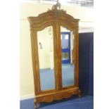 Continental walnut and mahogany armoire or wardrobe,