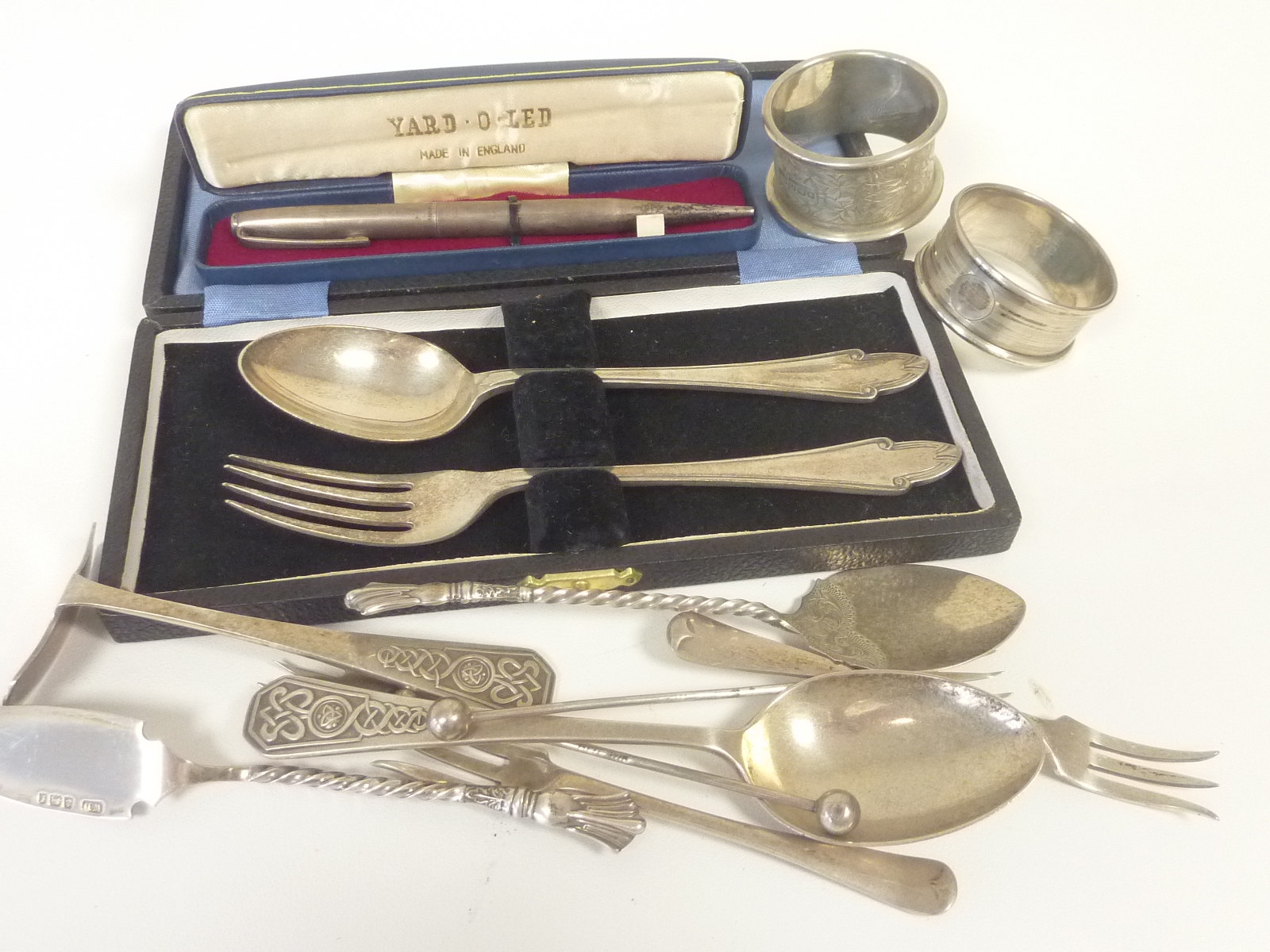 Silver spoon and fork cased, two napkin rings, a Yard-O-Led pencil cased and other items.