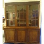 19th century mahogany library bookcase, plain pediment above three glazed astragal doors,