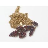 Victorian pyrope garnet cluster drop pendant in "garnet gold" on 9ct gold necklace.