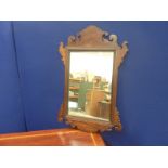 George III style mahogany fret carved wall mirror, 72cm high.