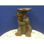 Black Forrest jardiniere stand in the form of a seated bear, 52cm.