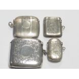 Three engraved silver vesta cases and another, engine turned.