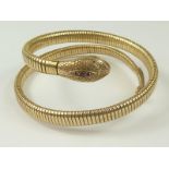 9ct gold snake bangle with gem set head. Condition Report.