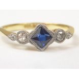 Early 20th century ring with diagonal collet set square sapphire and two diamonds "18ct and Pt".
