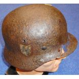 German. WWII M35 helmet with SS decal. In excavated condition.