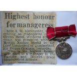 Medals. British Empire Medal; to Miss Agnes McCullough Mawhinney. With photocopy newspaper clipping.