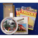 Three truck books and vehicle display case.