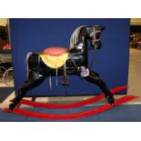 Victorian and later wooden rocking horse, horse-hair mane and tail, padded seat, glass eyes,