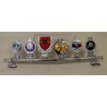 Car badge rail with six badges to include RAF badge